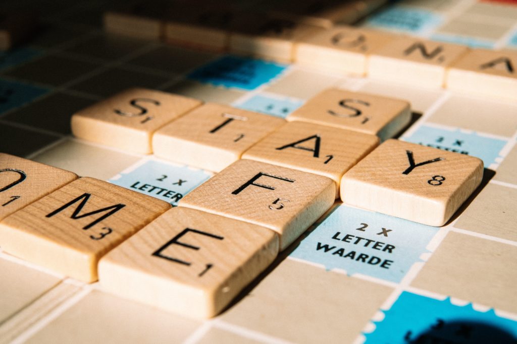 Canva - Letter tiles of board game on table-min